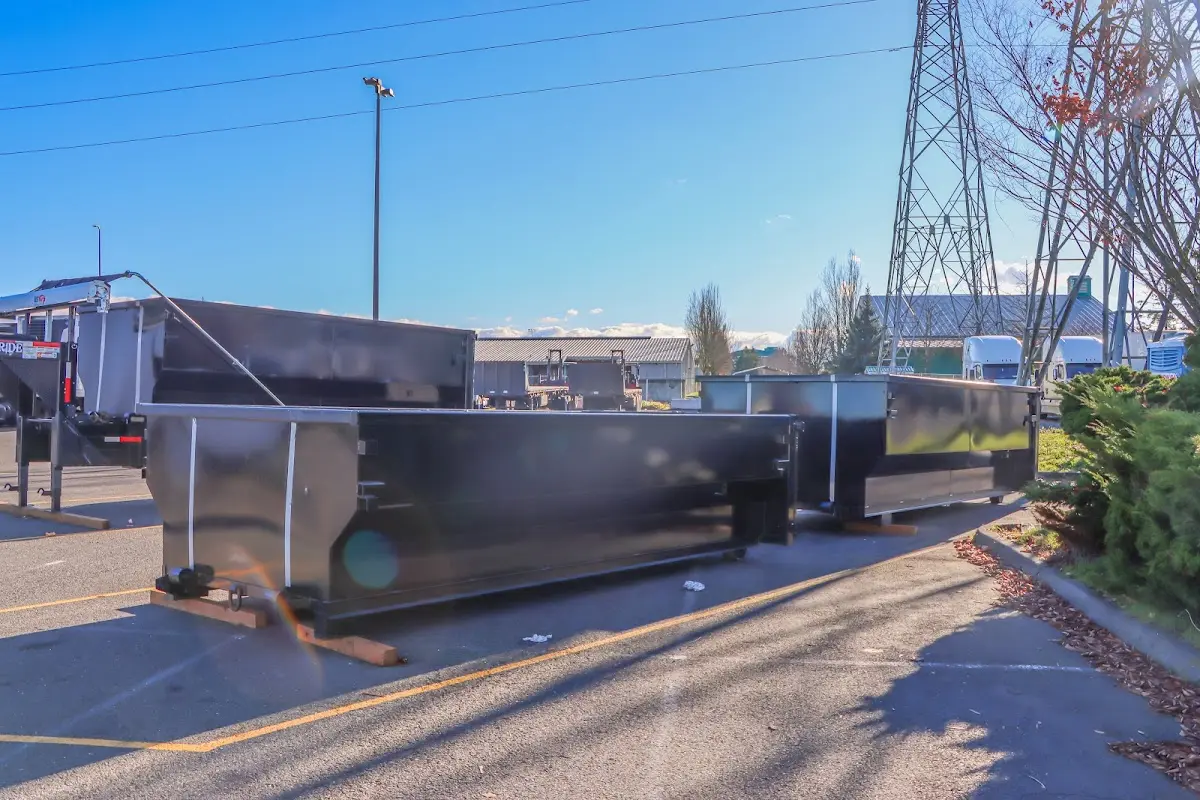 Roll-off dumpster ready for waste disposal at job site for 2 Yard Dumpster Rental in Hurst